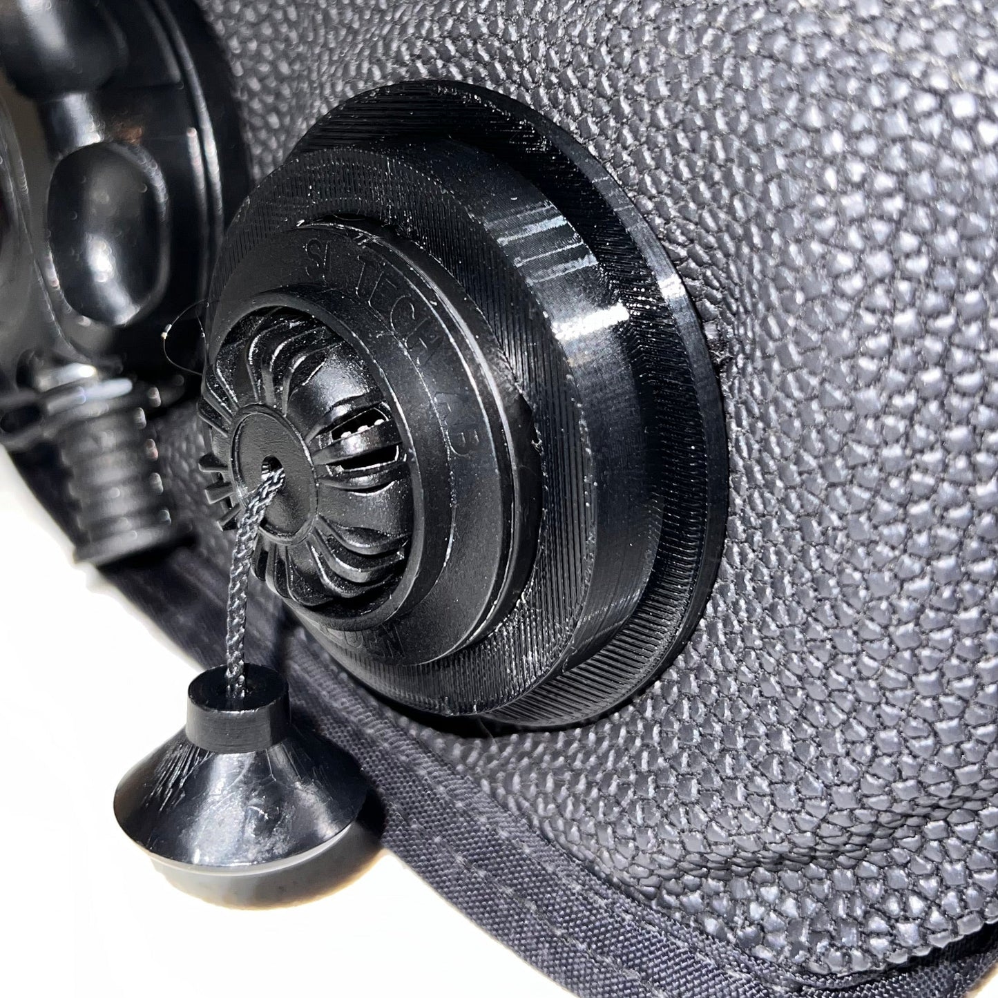 Black Pull Dump retention ring installed on a re-breather